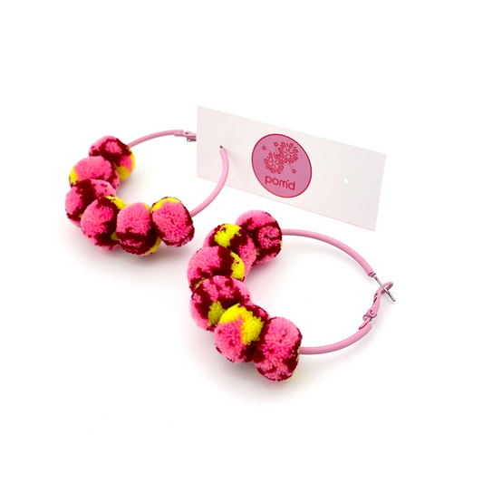 pom'd painted hoops in pink lemonade