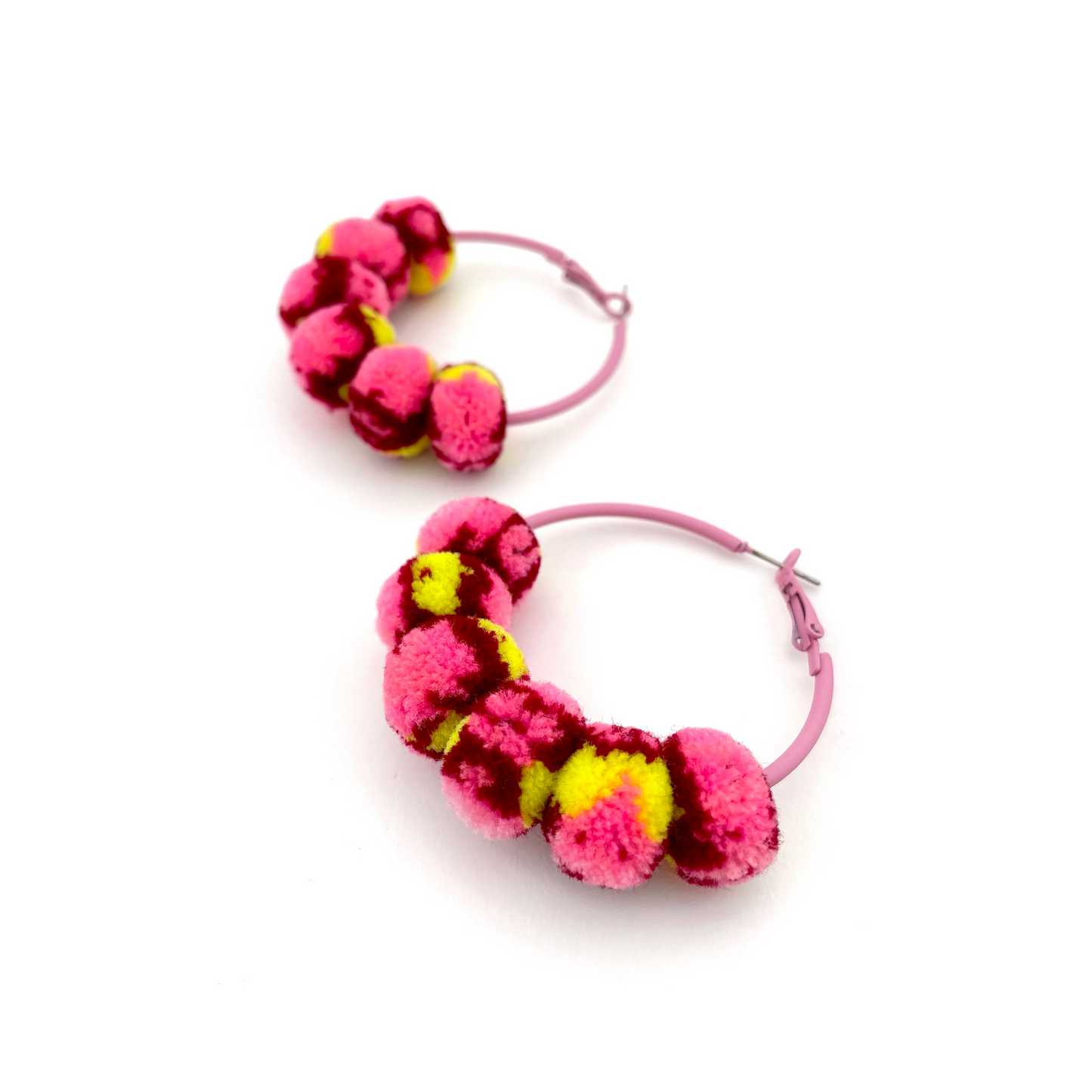 pom'd painted hoops in pink lemonade